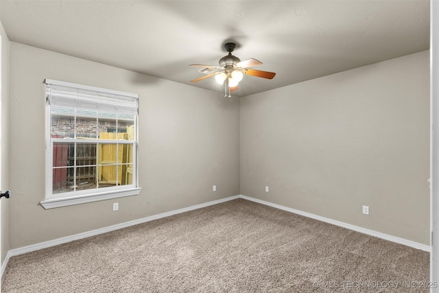 carpeted empty room featuring ceiling fan