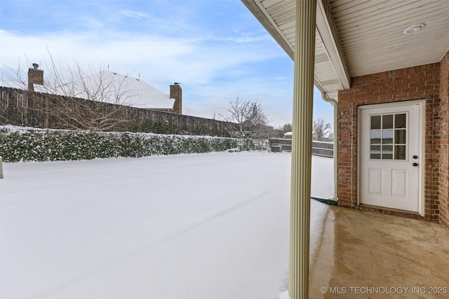 view of yard covered in snow