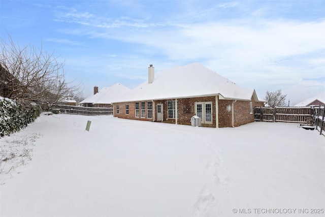 view of snow covered property