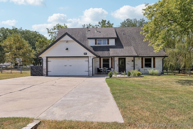 view of front of home featuring a garage and a front lawn