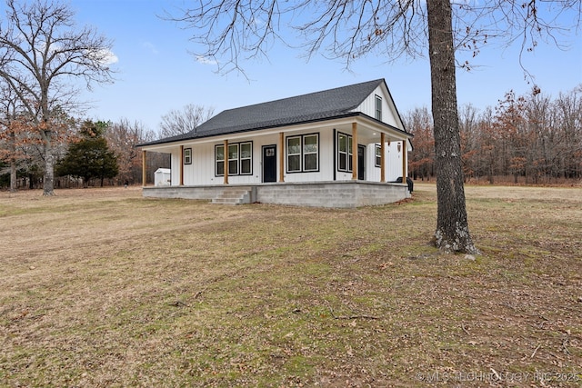 farmhouse inspired home featuring a front yard and a porch