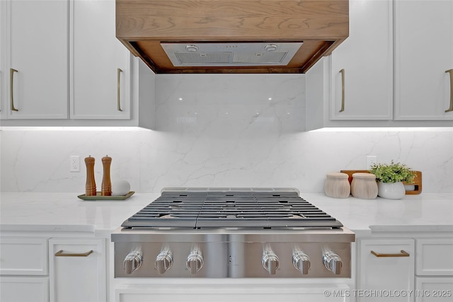 room details featuring white cabinetry, backsplash, ventilation hood, light stone countertops, and stainless steel gas stovetop