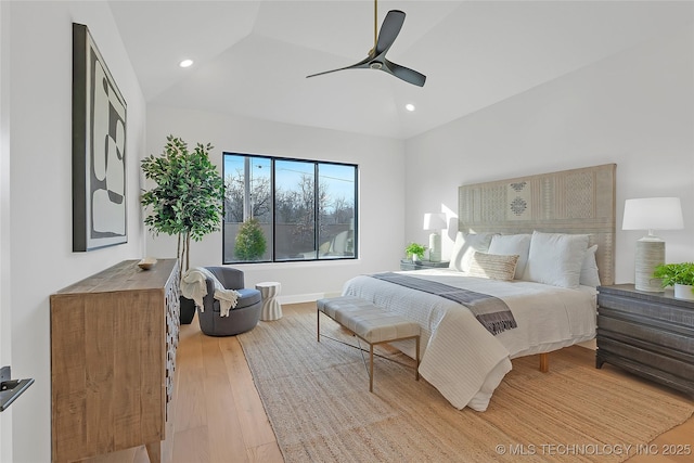 bedroom with light hardwood / wood-style flooring and ceiling fan