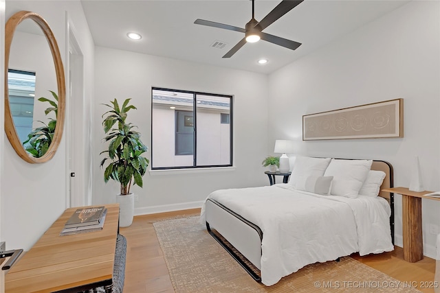 bedroom featuring ceiling fan and light hardwood / wood-style flooring