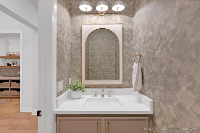 bathroom with vanity and wood-type flooring