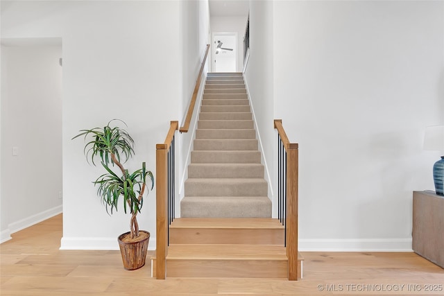 stairway featuring hardwood / wood-style flooring