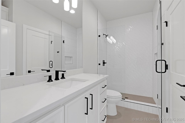 bathroom featuring walk in shower, vanity, and toilet