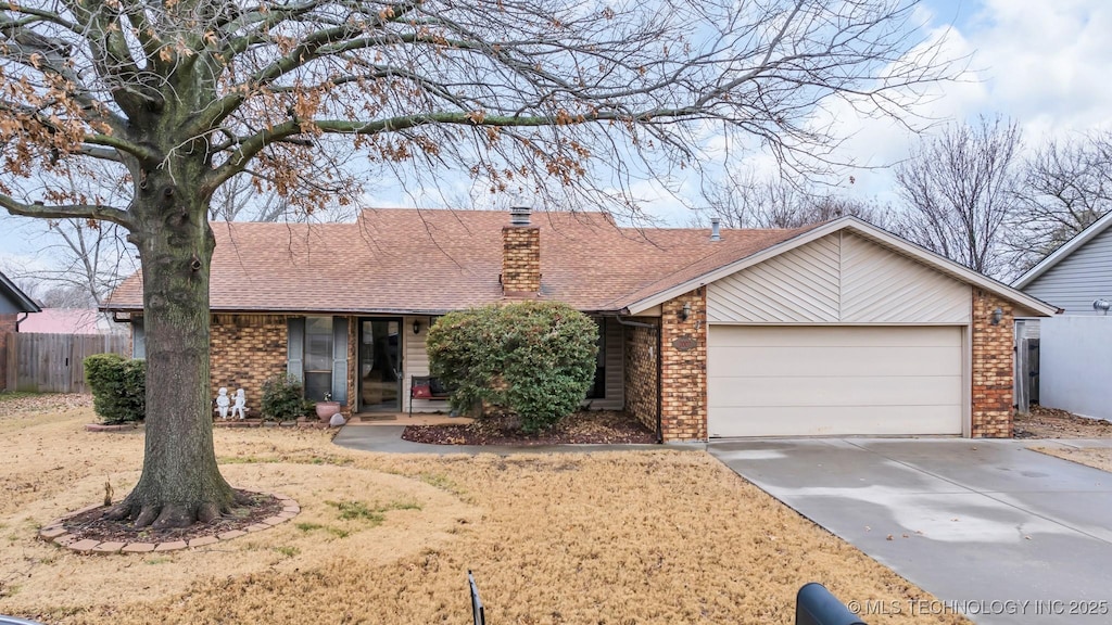 ranch-style home featuring a garage