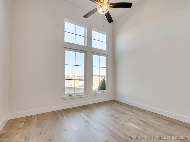 unfurnished room with ceiling fan, light hardwood / wood-style floors, and a healthy amount of sunlight