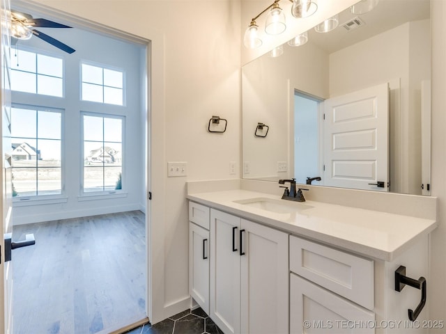 bathroom with vanity and ceiling fan