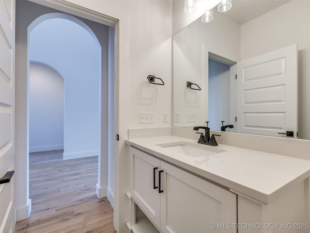 bathroom featuring vanity and hardwood / wood-style floors