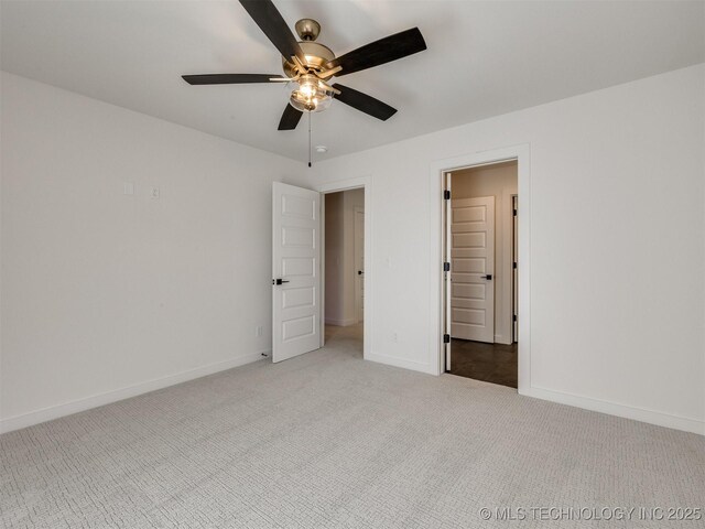 unfurnished bedroom featuring light carpet and ceiling fan