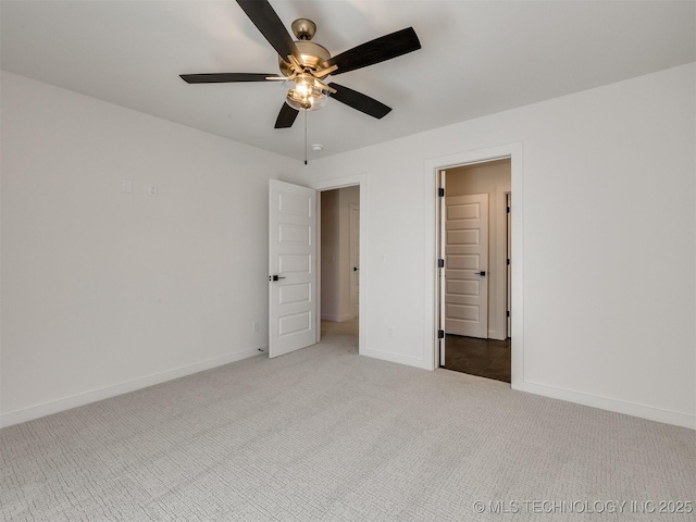 unfurnished bedroom with ceiling fan, baseboards, and light colored carpet