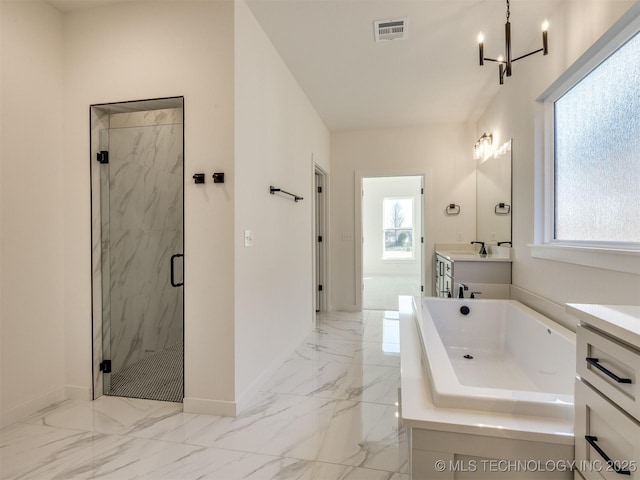 bathroom with vanity, a notable chandelier, and shower with separate bathtub