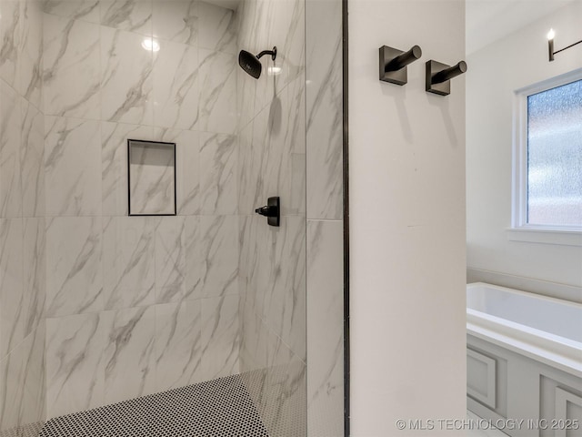 bathroom with a marble finish shower