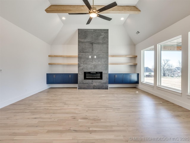 unfurnished living room featuring light wood-style flooring, a fireplace, visible vents, and baseboards