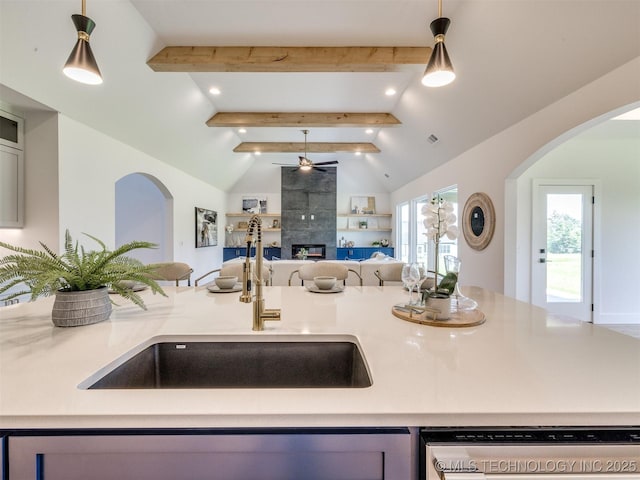 2508 E 135th Dr S, Bixby, OK 74008 - kitchen with dishwasher, open floor plan, arched walkways, a ceiling fan, and a sink
