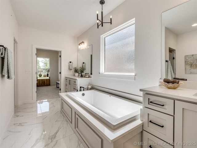 2508 E 135th Dr S, Bixby, OK 74008 - bathroom featuring ensuite bath, marble tiled flooring, a tub to relax in, vanity, and a chandelier