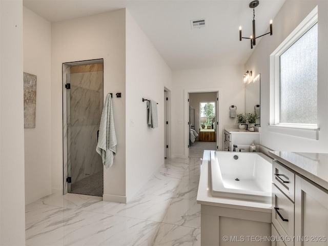 2508 E 135th Dr S, Bixby, OK 74008 - bathroom featuring marble tiled flooring, a marble finish shower, a chandelier, and ensuite bath
