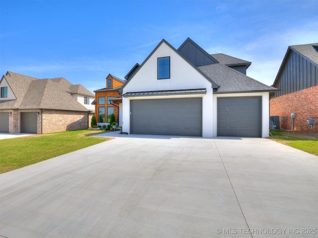 2508 E 135th Dr S, Bixby, OK 74008 - view of front of property featuring driveway, a standing seam roof, a front lawn, a garage, and metal roof