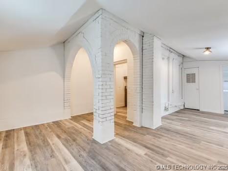 empty room with light hardwood / wood-style floors