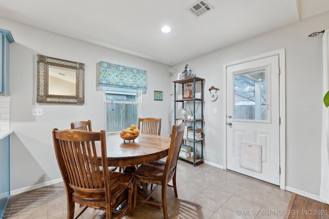 dining area featuring a healthy amount of sunlight and light tile patterned floors