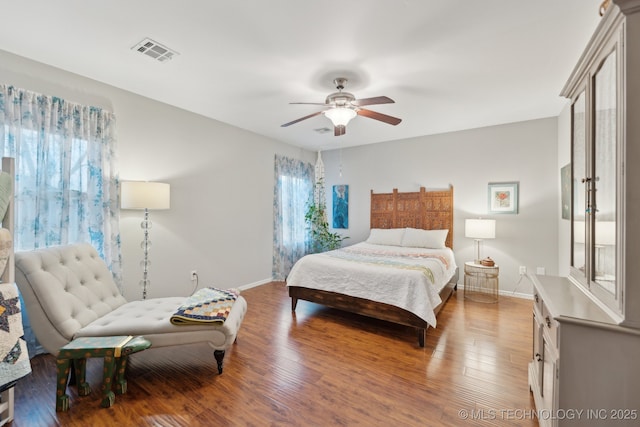 bedroom with hardwood / wood-style floors and ceiling fan