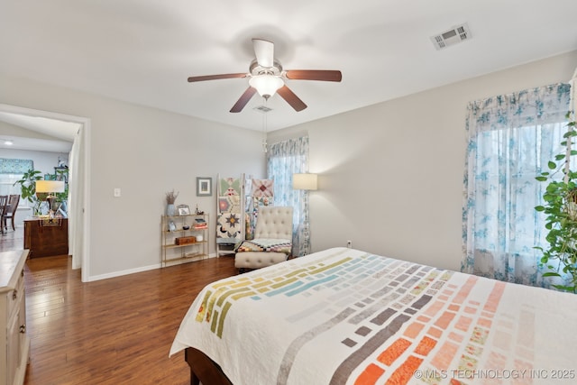 bedroom featuring ceiling fan and dark hardwood / wood-style flooring