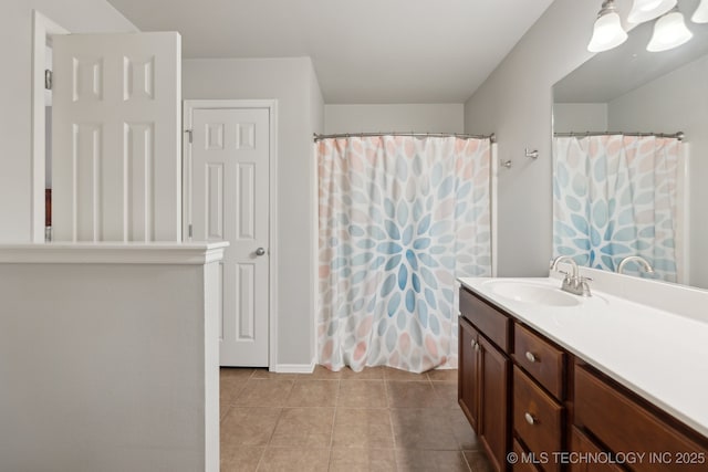 bathroom featuring tile patterned flooring and vanity