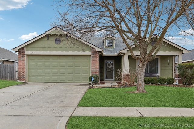 view of front of property with a garage and a front lawn