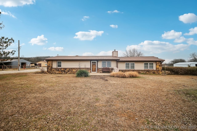 ranch-style house with a front lawn