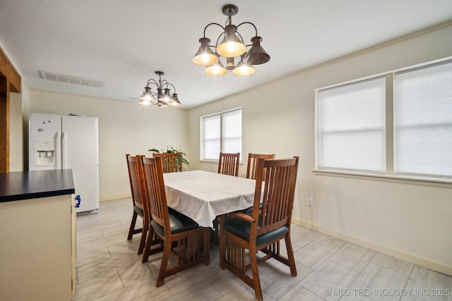 dining room with a chandelier