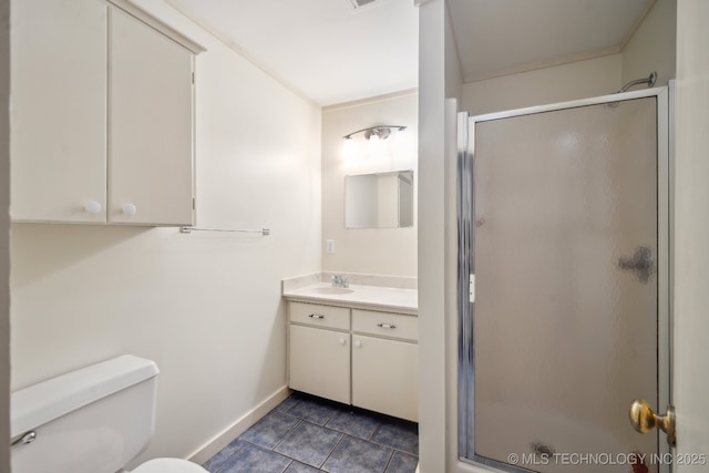 bathroom featuring vanity, toilet, tile patterned floors, and walk in shower