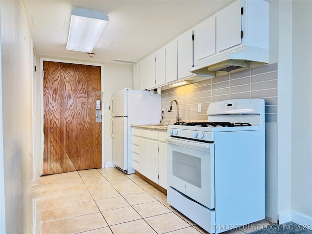 kitchen with white cabinets, white appliances, and decorative backsplash