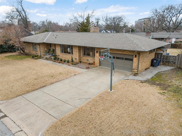 ranch-style home featuring a garage and a front lawn