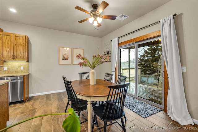 dining room featuring ceiling fan and light wood-type flooring