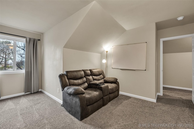 home theater featuring carpet and lofted ceiling