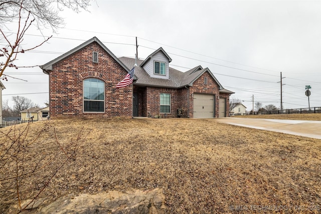 view of front of home with a garage and a front yard