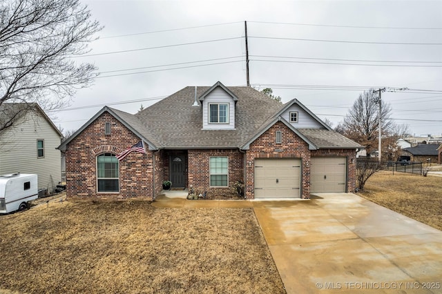 view of front of property featuring a garage and a front yard