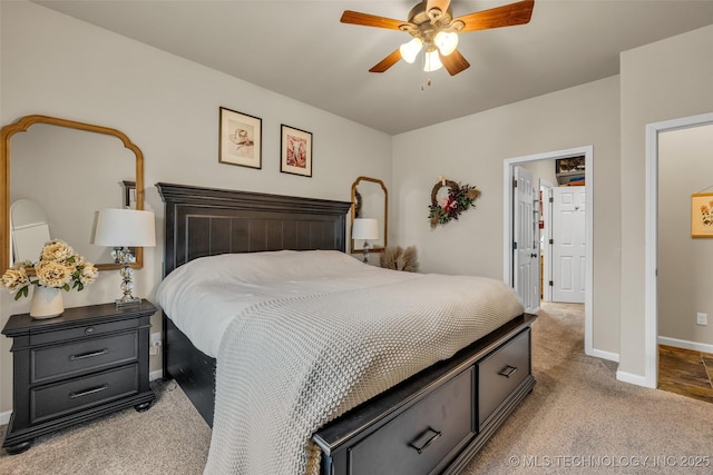 bedroom featuring ceiling fan and light carpet