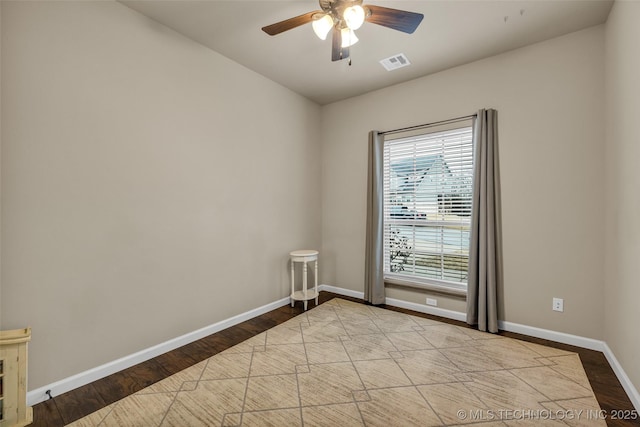 empty room with ceiling fan and light wood-type flooring