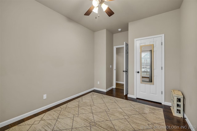 unfurnished room with hardwood / wood-style flooring and ceiling fan