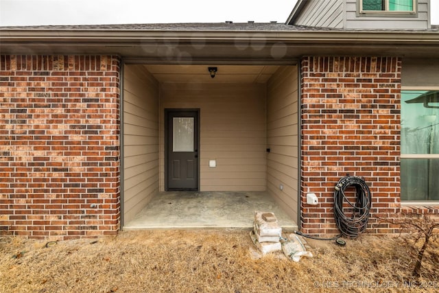 doorway to property featuring a patio