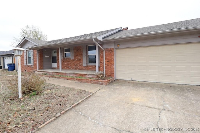 single story home with a garage and a porch