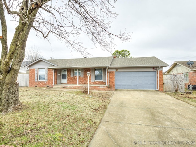 ranch-style home with a garage and a front yard