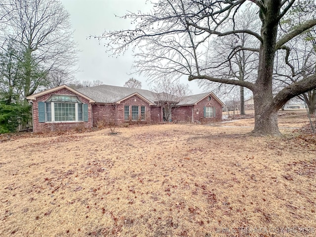 ranch-style house with brick siding