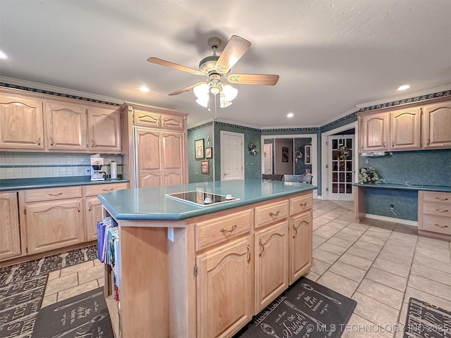 kitchen featuring a center island, dark countertops, and light brown cabinetry