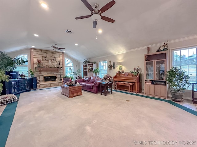 living room with visible vents, ornamental molding, carpet, vaulted ceiling, and a stone fireplace