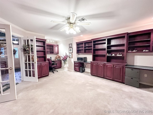 office space with visible vents, a ceiling fan, light colored carpet, crown molding, and french doors