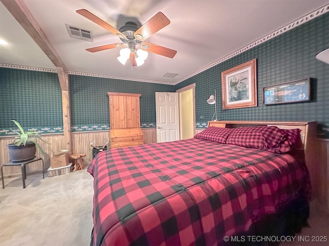 bedroom with visible vents and wallpapered walls